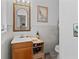 Well-lit bathroom featuring a vanity with mirror, tile walls, and ample counter space at 314 Avalone Dr, Apopka, FL 32703