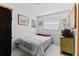 A comfy bedroom with a large window and minimalist decor creates a serene and inviting space at 314 Avalone Dr, Apopka, FL 32703