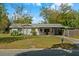 Charming single-story home with a well-maintained lawn and covered porch at 314 Avalone Dr, Apopka, FL 32703