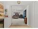 Open concept: the kitchen leads to a comfortably furnished living room with neutral tones at 314 Avalone Dr, Apopka, FL 32703
