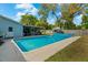 A refreshing pool with an adjacent screened-in porch, offering an ideal outdoor living space at 314 Avalone Dr, Apopka, FL 32703