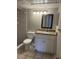 Cozy bathroom featuring a shower with gray tile and a vanity with a granite countertop at 315 Lakepointe Dr # 201, Altamonte Springs, FL 32701