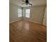 Bedroom featuring hardwood floors, neutral walls, and dual windows at 315 Lakepointe Dr # 201, Altamonte Springs, FL 32701