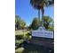 Entrance to Lakewood Park, featuring lush landscaping and a well-maintained community sign at 315 Lakepointe Dr # 201, Altamonte Springs, FL 32701