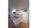 Bright kitchen with white cabinets, stone countertops, and modern appliances at 315 Lakepointe Dr # 201, Altamonte Springs, FL 32701