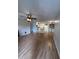 Spacious living room featuring hardwood floors, ceiling fan, and leading into kitchen at 315 Lakepointe Dr # 201, Altamonte Springs, FL 32701
