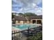 Community pool surrounded by lush landscaping, perfect for relaxation and recreation at 315 Lakepointe Dr # 201, Altamonte Springs, FL 32701