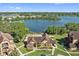 Aerial view of the clubhouse showing proximity to the lake, and pool with lounging area at 325 Lakepointe Dr # 303, Altamonte Springs, FL 32701