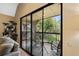 Sliding doors lead to the balcony overlooking lush greenery at 325 Lakepointe Dr # 303, Altamonte Springs, FL 32701