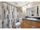 Well-maintained bathroom with shower/tub combo, gray vanity, and updated fixtures and decor at 325 Lakepointe Dr # 303, Altamonte Springs, FL 32701