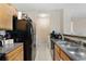 Practical kitchen features stainless steel sinks and appliances at 325 Lakepointe Dr # 303, Altamonte Springs, FL 32701