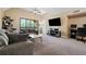 Spacious living room features a ceiling fan and large window allowing natural light at 325 Lakepointe Dr # 303, Altamonte Springs, FL 32701