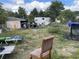 Untidy backyard with assorted objects and overgrown vegetation at 330 S Buena Vista Ave, Orlando, FL 32835