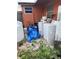 Backyard with old appliances and covered items at 330 S Buena Vista Ave, Orlando, FL 32835