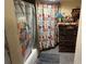 Small bathroom with shower and colorful shower curtain at 330 S Buena Vista Ave, Orlando, FL 32835