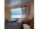 This bedroom has an air conditioner and natural light from the window at 330 S Buena Vista Ave, Orlando, FL 32835