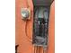 Exterior shot revealing an aging outdoor electrical panel with a meter at 330 S Buena Vista Ave, Orlando, FL 32835