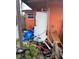 Exterior shot revealing an outdoor water heater with miscellaneous items cluttered around it at 330 S Buena Vista Ave, Orlando, FL 32835