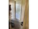 The hallway features bare floors, dated paint, and an outdated door at 330 S Buena Vista Ave, Orlando, FL 32835