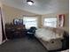 Cozy living room with a piano, TV, and comfortable seating arrangement under a ceiling light at 330 S Buena Vista Ave, Orlando, FL 32835