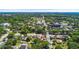 Wide aerial view of a neighborhood with tree-lined streets and various residential homes at 335 W Bay St, Winter Garden, FL 34787