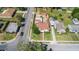 An aerial view shows the home's layout, landscaping, and nearby street access in the surrounding neighborhood at 335 W Bay St, Winter Garden, FL 34787