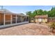Paver patio in backyard, with screened in patio and shed at 335 W Bay St, Winter Garden, FL 34787