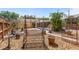 Charming backyard with relaxing bench swing and decorative stone features at 335 W Bay St, Winter Garden, FL 34787