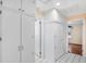 Hallway with tiled floors and built in storage cabinets at 335 W Bay St, Winter Garden, FL 34787
