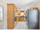 Bright kitchen with stainless steel appliances, granite countertops, and custom wood cabinets at 335 W Bay St, Winter Garden, FL 34787