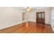 Spacious living room featuring hardwood floors, a ceiling fan, and a decorative cabinet at 335 W Bay St, Winter Garden, FL 34787