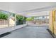 Enclosed patio with concrete floor, screened windows, and privacy views at 335 W Bay St, Winter Garden, FL 34787