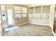 Enclosed porch featuring many windows with ample sunlight and neutral decor at 335 W Bay St, Winter Garden, FL 34787
