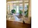 Bright sunroom with tiled floor and furnished sitting and dining areas at 335 W Bay St, Winter Garden, FL 34787