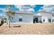 Backyard features a sliding glass door and a view of the surrounding properties at 33891 Sky Blossom Cir, Leesburg, FL 34788