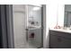 Bathroom showcasing a walk-in shower with glass doors and a double sink vanity at 33891 Sky Blossom Cir, Leesburg, FL 34788