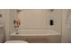 Clean, white bathtub and shower combination, offering a functional and well-maintained bathroom space at 33891 Sky Blossom Cir, Leesburg, FL 34788