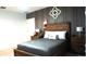 Cozy bedroom with a wood-framed bed, matching nightstands, and tasteful decor, creating a relaxing retreat at 33891 Sky Blossom Cir, Leesburg, FL 34788
