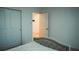 Bedroom with a bed, two doors and doorway at 33891 Sky Blossom Cir, Leesburg, FL 34788