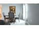 A cozy dining area is decorated with gray walls, white trim and lots of light from a window at 33891 Sky Blossom Cir, Leesburg, FL 34788
