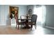 Bright dining room features a wood table, chairs, and stylish decor, offering a welcoming space for meals at 33891 Sky Blossom Cir, Leesburg, FL 34788