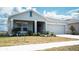 Inviting one-story home with a covered entry and attached two-car garage at 33891 Sky Blossom Cir, Leesburg, FL 34788