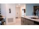 View from the kitchen to the front door, highlighting an open-concept design at 33891 Sky Blossom Cir, Leesburg, FL 34788