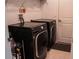Laundry room with modern washer and dryer, providing convenience and efficiency for household chores at 33891 Sky Blossom Cir, Leesburg, FL 34788