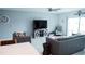 An open living room area features tile floors, comfortable seating and a sliding door to the exterior at 33891 Sky Blossom Cir, Leesburg, FL 34788