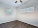 This bedroom offers natural light from two windows and stylish wood-look flooring, perfect for relaxation at 3600 Merryweather Dr, Orlando, FL 32812