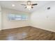 Bright and airy bedroom with hardwood floors, ceiling fan, and ample natural light from a window at 3600 Merryweather Dr, Orlando, FL 32812