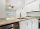 Modern kitchen featuring stainless steel appliances, white cabinets, granite countertops and ample lighting at 3600 Merryweather Dr, Orlando, FL 32812
