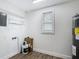 Functional laundry room with shelving, new floors, a window, and a modern water heater for efficiency at 3600 Merryweather Dr, Orlando, FL 32812