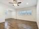 Spacious living room featuring hardwood floors, neutral paint, and abundant natural light at 3600 Merryweather Dr, Orlando, FL 32812